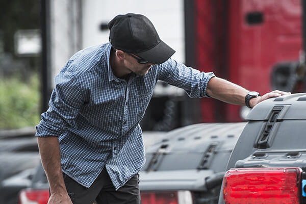 Customer reviewing pre-owned semi trucks for sale in Nebraska